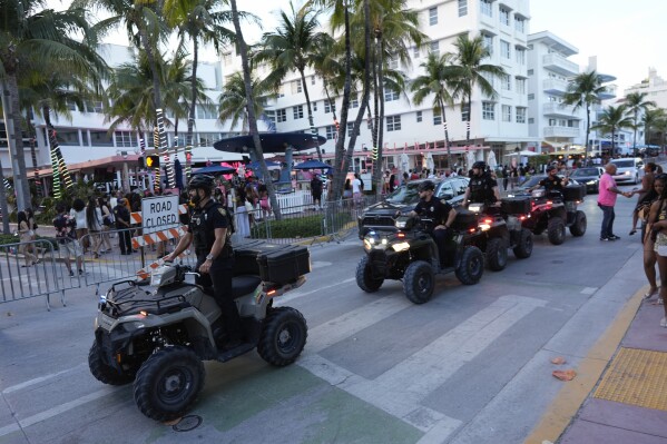 Police on all-terrain vehicles patrol along Ocean Drive during spring break, March 15, 2024, in Miami Beach, Fla. (AP Photo/Rebecca Blackwell, File)