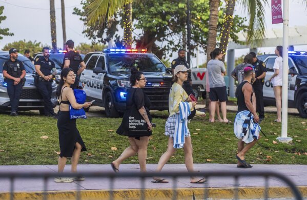 City of Miami Beach police officers are staged along Ocean Drive during spring break on South Beach, in Miami Beach, Fla., March 9, 2024. (Pedro Portal/Miami Herald via AP, File)