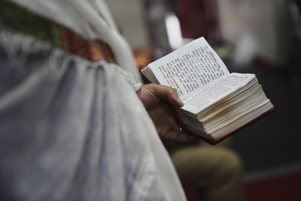 Congregants attend an hours-long service at Re'ese Adbarat Debre Selam Kidist Mariam Church, an Ethiopian Orthodox Tewahedo church, in Washington, D.C., Saturday, April 5, 2025. (AP Photo/Jessie Wardarski)