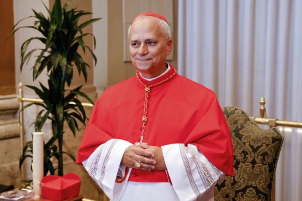 New Cardinal Robert Francis Prevost, Prefect of the Dicastery for Bishops, poses for a photo at the end of the consistory where Pope Francis elevated 21 new cardinals in St. Peter's Square at the Vatican, Saturday, Sept. 30, 2023. (AP Photo/Riccardo De Luca, file)
