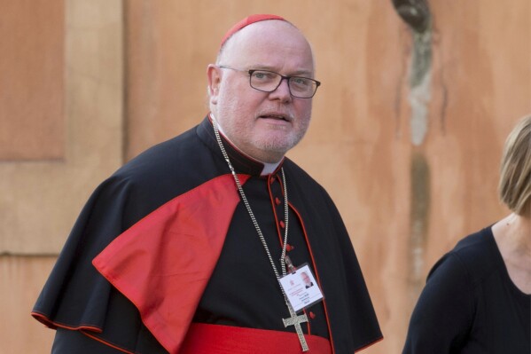 German Cardinal Reinhard Marx arrives for a morning session of a two-week synod on family issues at the Vatican, o, Oct. 6, 2014. (AP Photo/Alessandra Tarantino, File)