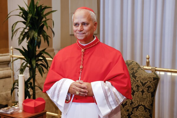 New Cardinal Robert Francis Prevost, Prefect of the Dicastery for Bishops, poses for a photo at the end of the consistory where Pope Francis elevated 21 new cardinals in St. Peter's Square at the Vatican, Saturday, Sept. 30, 2023. (AP Photo/Riccardo De Luca, file)