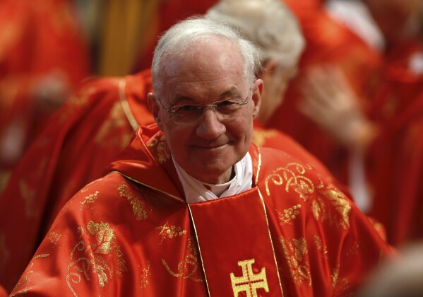 Canadian Cardinal Marc Ouellet attends a Mass inside St. Peter’s Basilica, at the Vatican, on March 12, 2013. (AP Photo/Andrew Medichini, File)