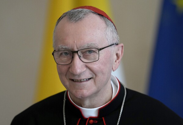 Vatican Secretary of State Cardinal Pietro Parolin smiles as he is welcomed by German President Frank-Walter Steinmeier for a meeting at the Bellevue palace in Berlin, Germany, June 29, 2021. (AP Photo/Michael Sohn, file)