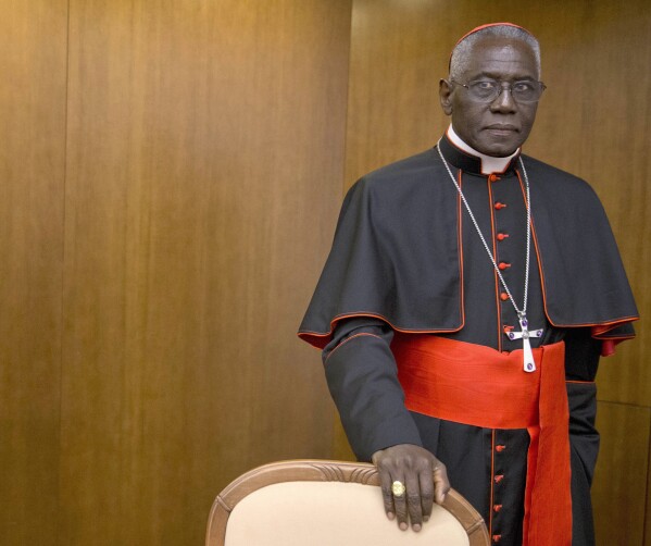 Cardinal Robert Sarah, prefect of the Congregation for Divine Worship and the Discipline of the Sacraments, arrives for the presentation of Cardinal Raymond Leo Burke's book Divine Love Made Flesh, in Rome, Oct. 14, 2015. (AP Photo/Andrew Medichini)