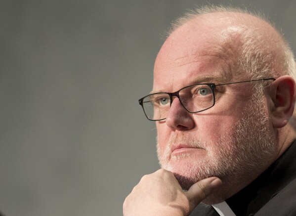 German Cardinal Reinhard Marx attends a press conference by Vatican spokesman Rev. Federico Lombardi at the Vatican’s press center, Oct. 21, 2015. (AP Photo/Andrew Medichini, File)
