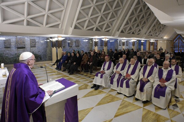 Pope Francis celebrates Mass at the Santa Marta chapel at the Vatican, Friday, Feb. 16, 2018. (L'Osservatore Romano/Pool Photo via AP, file)