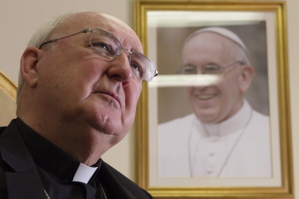 Cardinal Kevin Farrell, head of the Vatican's family and laity office, talks during an interview with The Associated Press in office in Rome, Tuesday, July 31, 2018. (AP Photo/Paolo Santalucia, file)